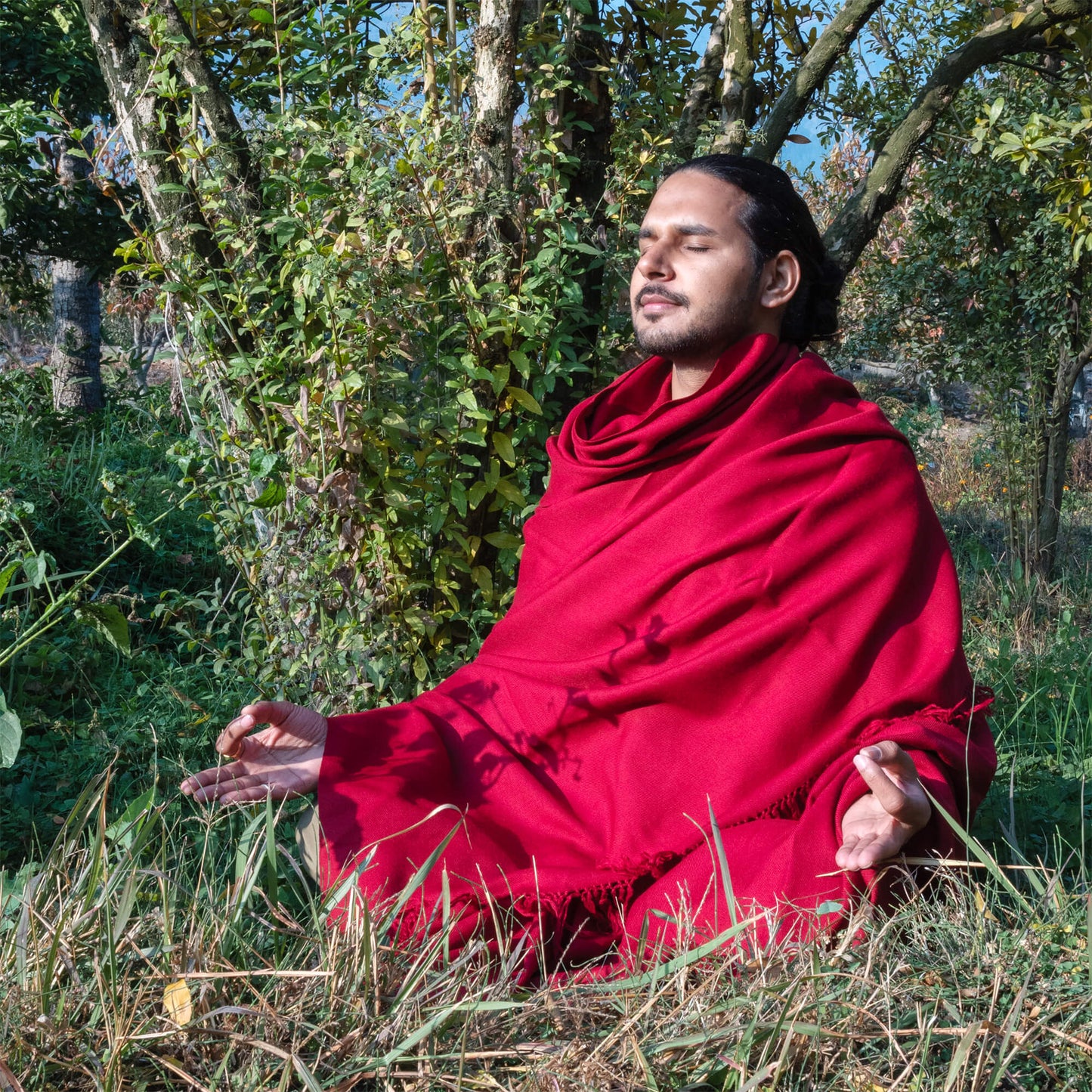 maroon meditation shawl wraped around a man