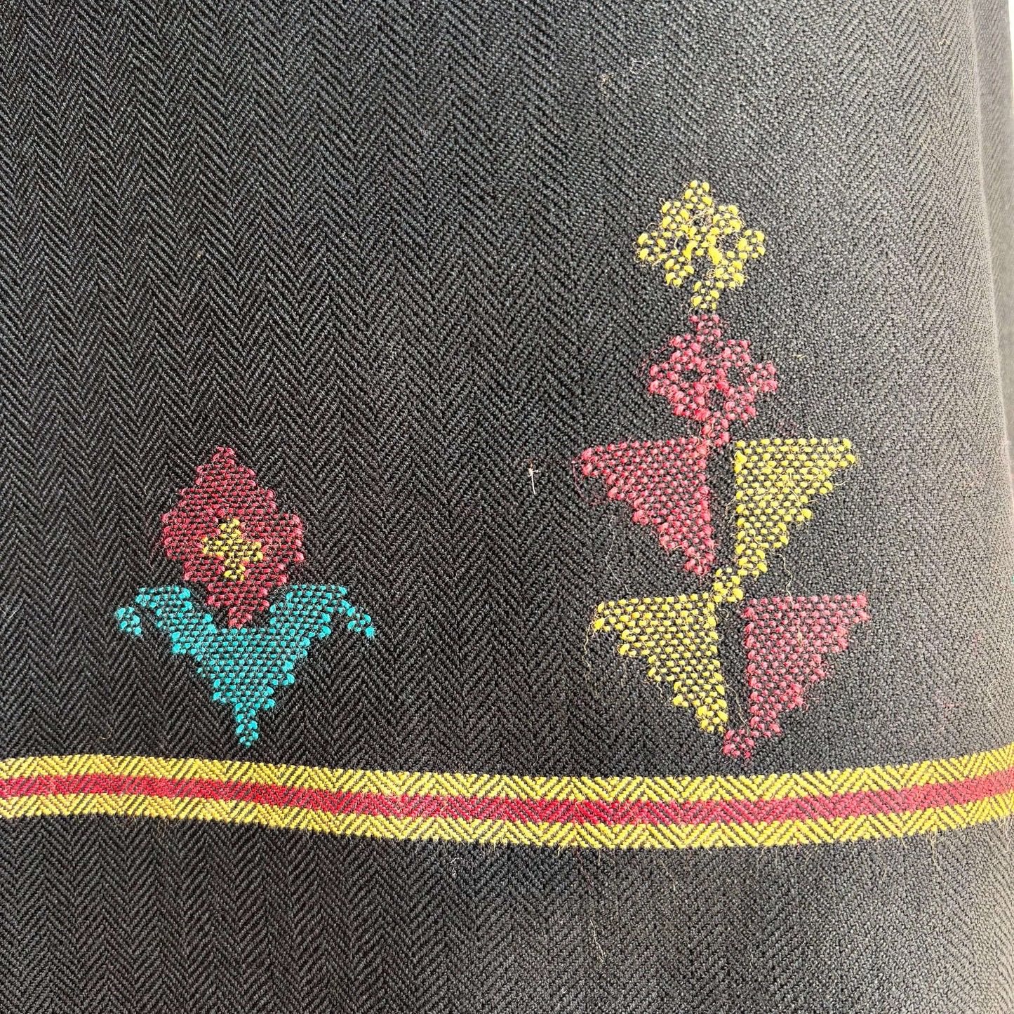 Close-up of designs in black polywool from Bhuttico handloom suit set