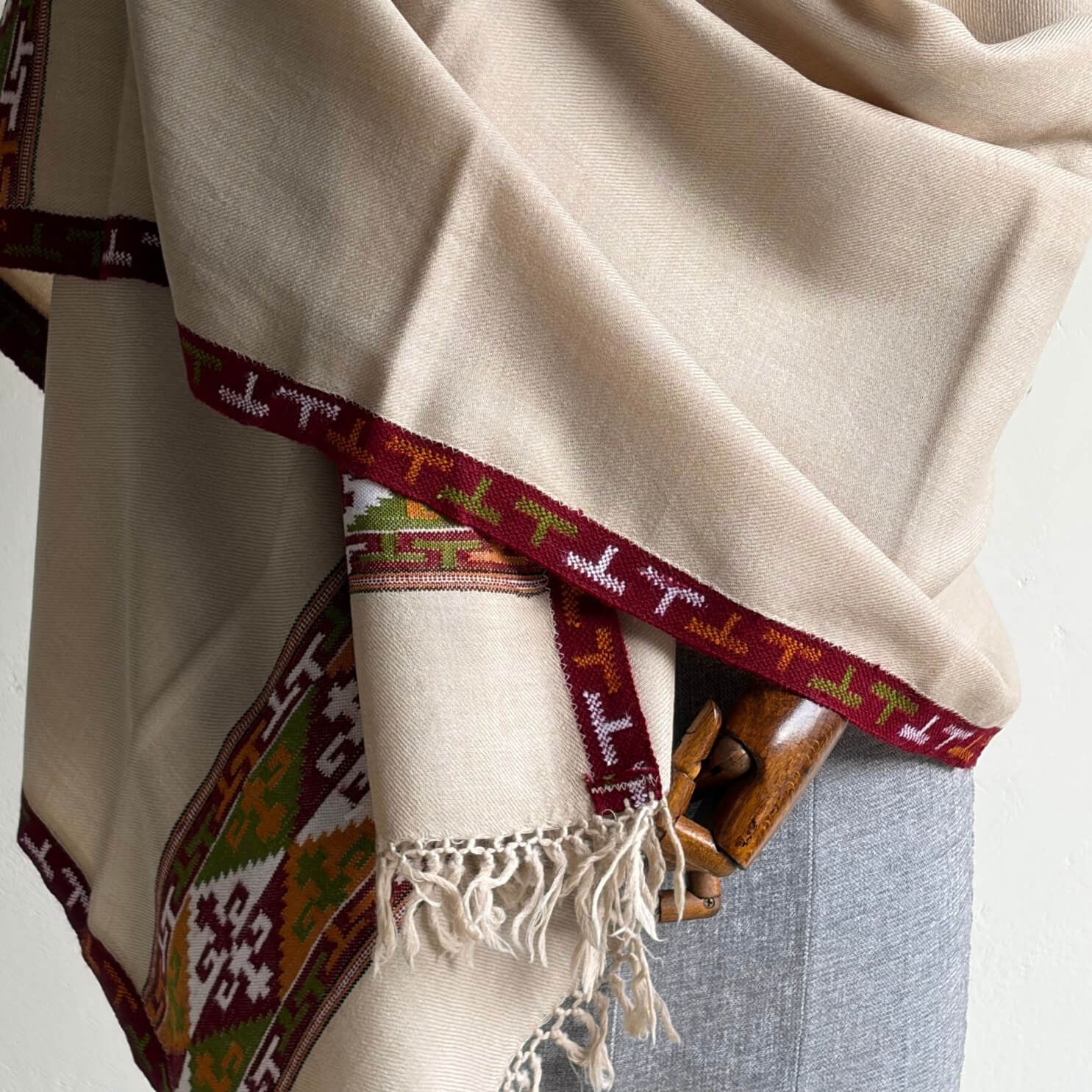 Closeup of Beige Pure merino Kullu shawl with patterned edge 