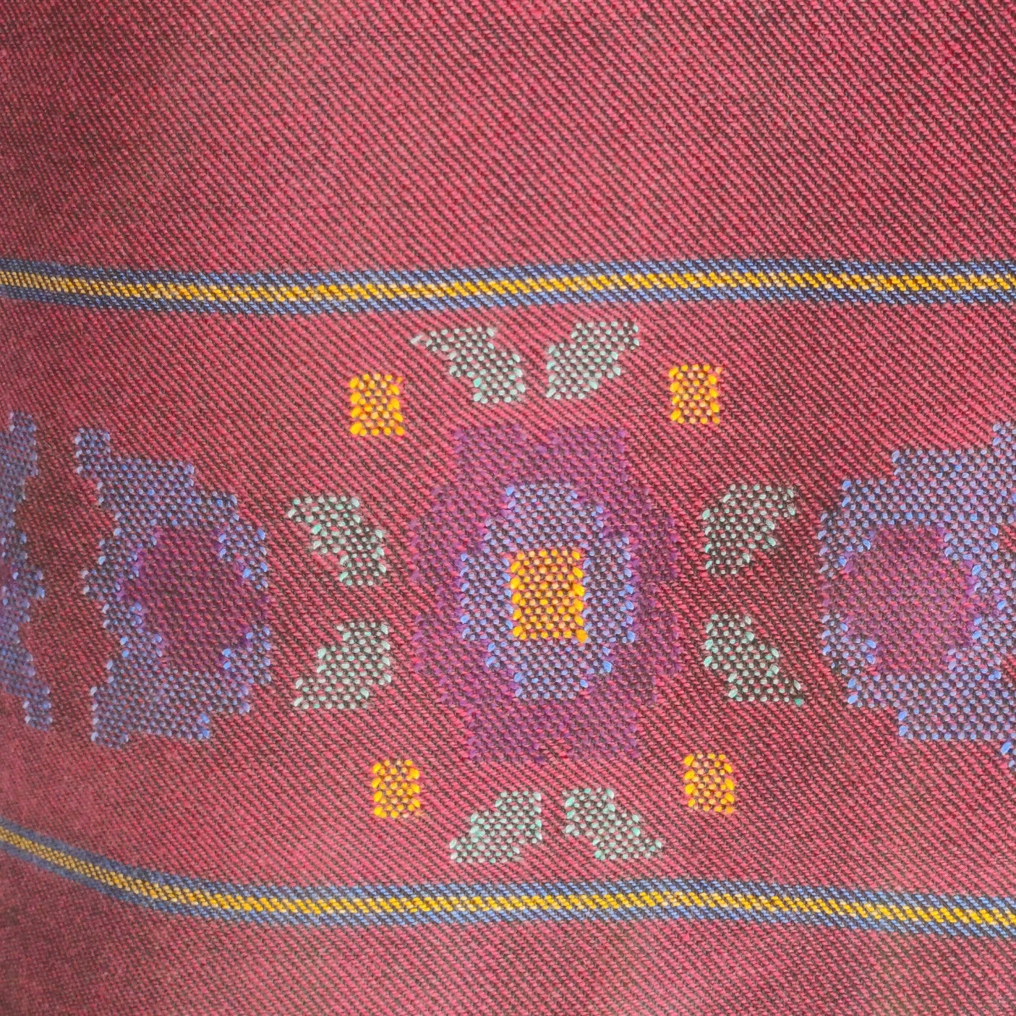 Close-up of maroon woolen suit for women 