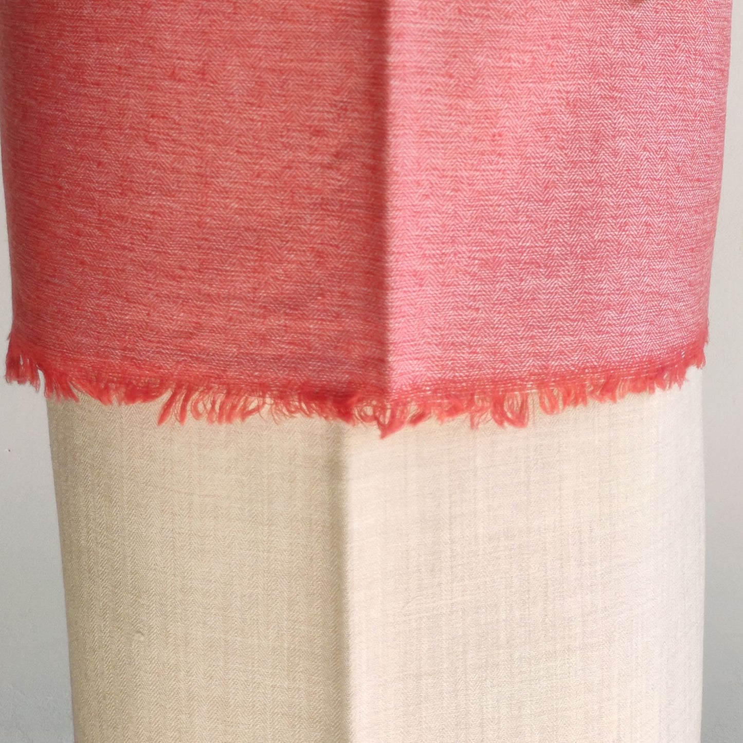 Close-up of a rust pink and beige woolen suit for women