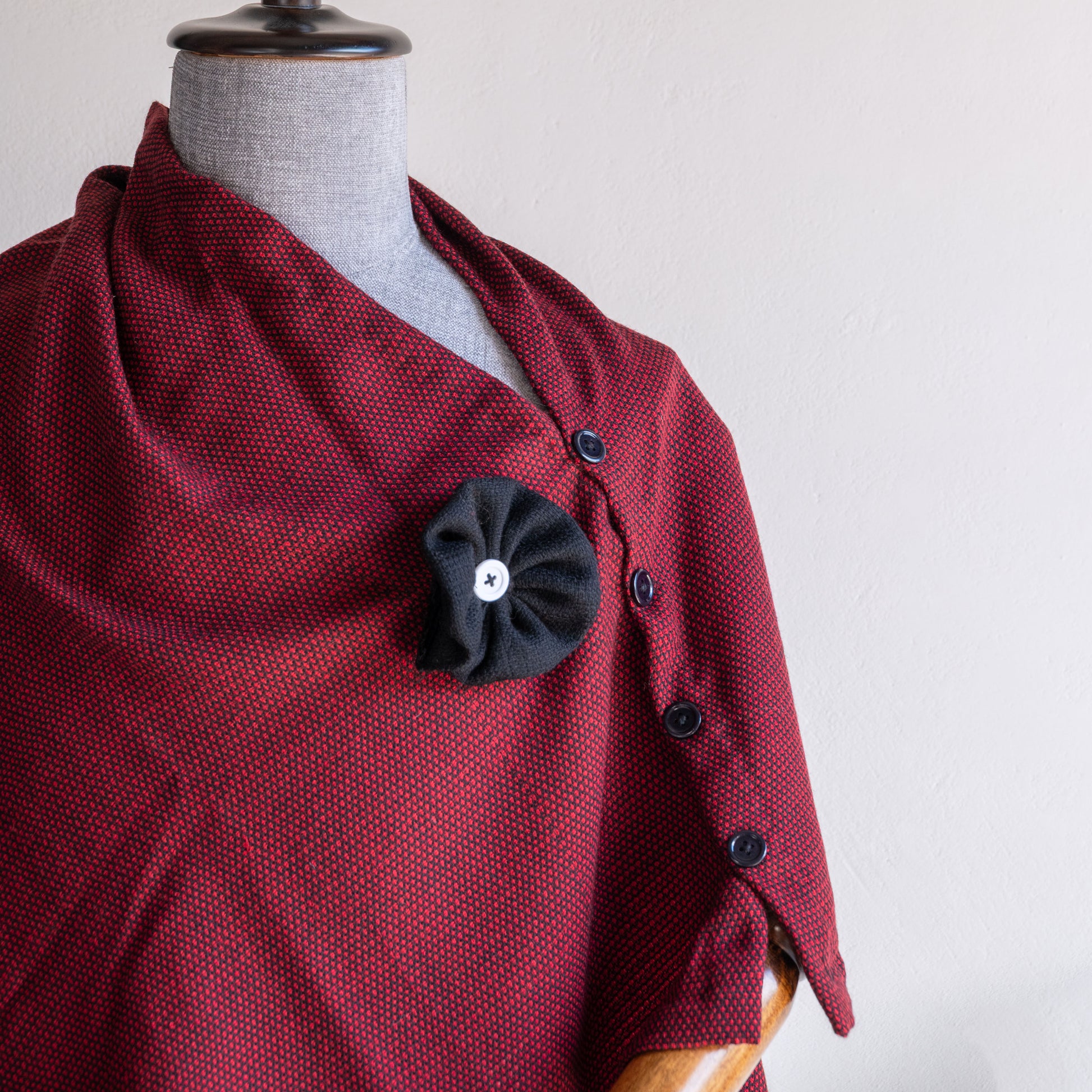 Maroon woolen cape for women closeup shot