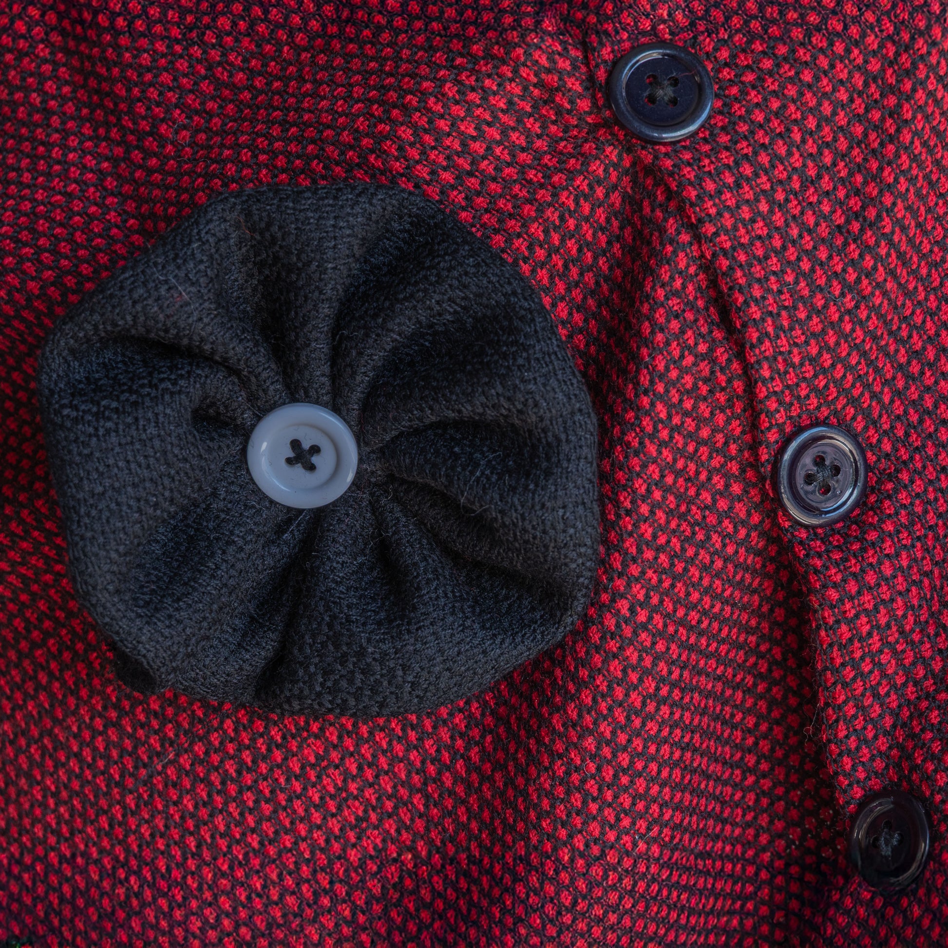 Black flower on maroon cape for women