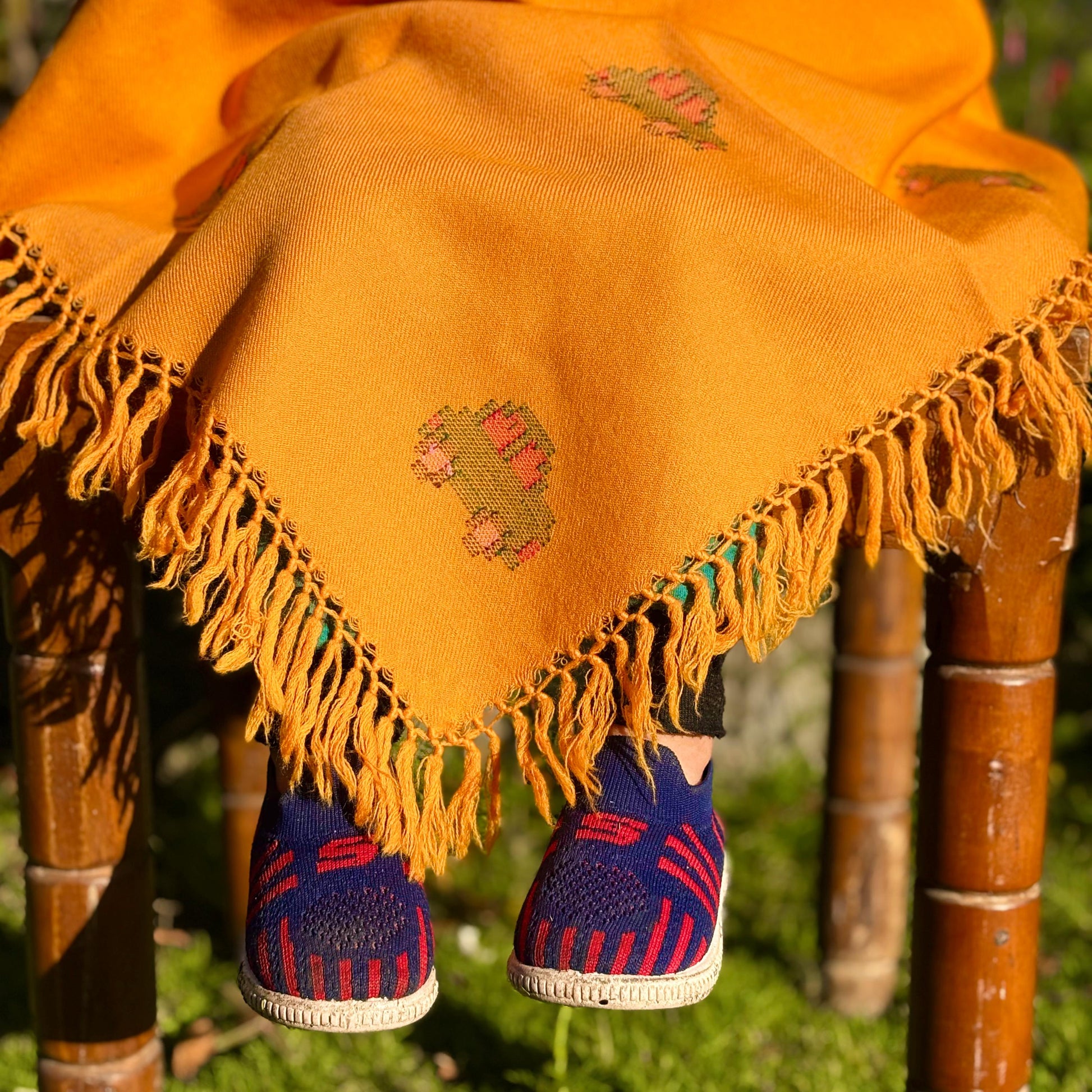Close up of Sunshine Car Kids Poncho in mustard yellow
