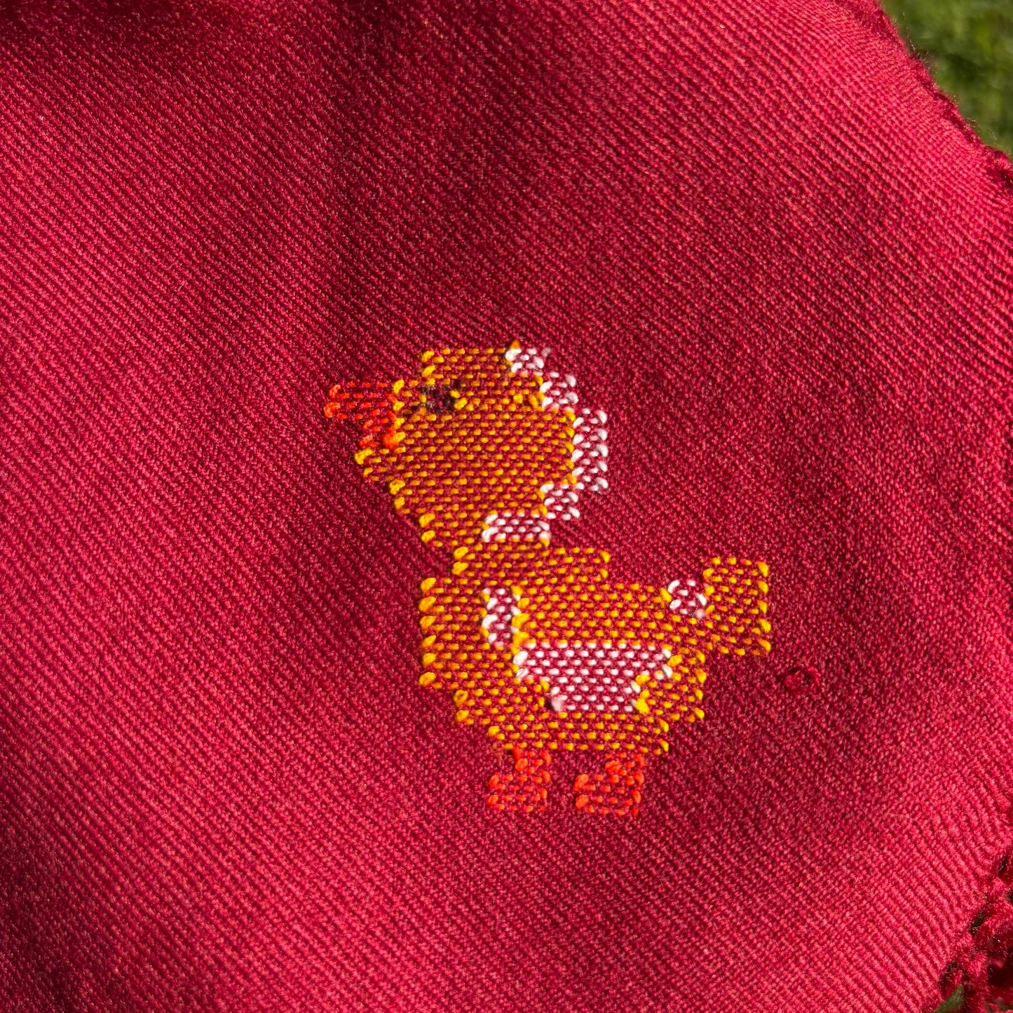 “Red Ruby Duck Kids Poncho made from pure merino wool by Bhuttico”